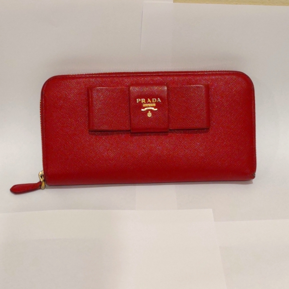 Prada red saffiano leather bow front zip around long wallet